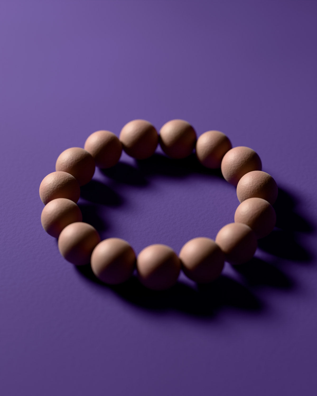 The Elegant Orchid & Ambergris bracelet with 12 mm beads, a 3D rendering